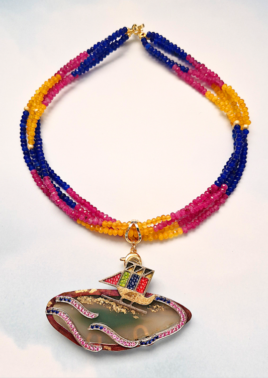 Colorful beaded necklace with a Vinta boat on a beach pendant with gemstones and stingray leather