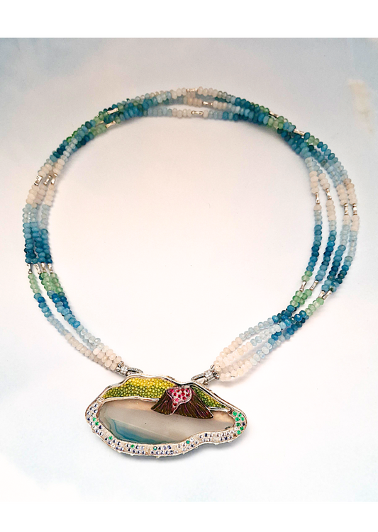 Necklace with a taal volcano pendant with gemstones and stingray leather