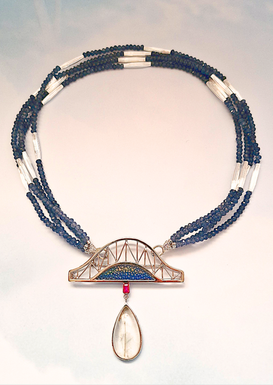 Multistrand beaded necklace with a bridge pendant