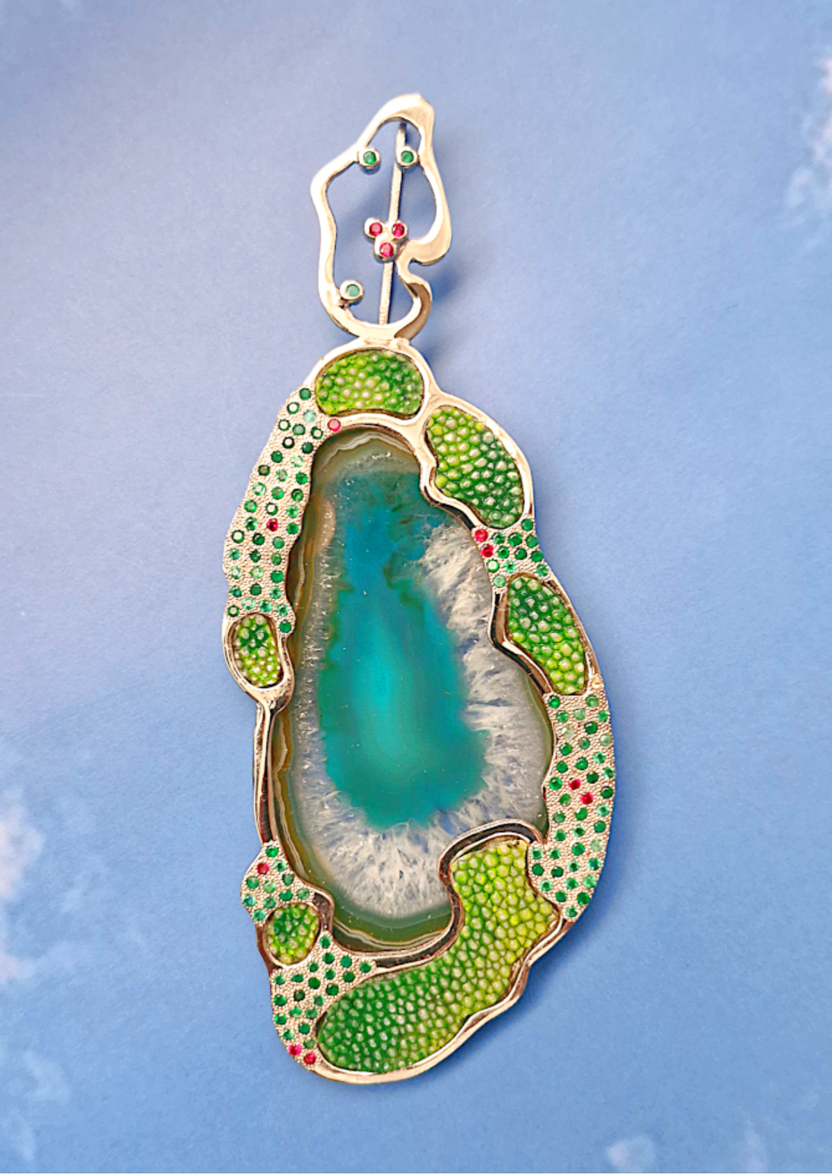 Decorative object with green and gold detailing on a blue background